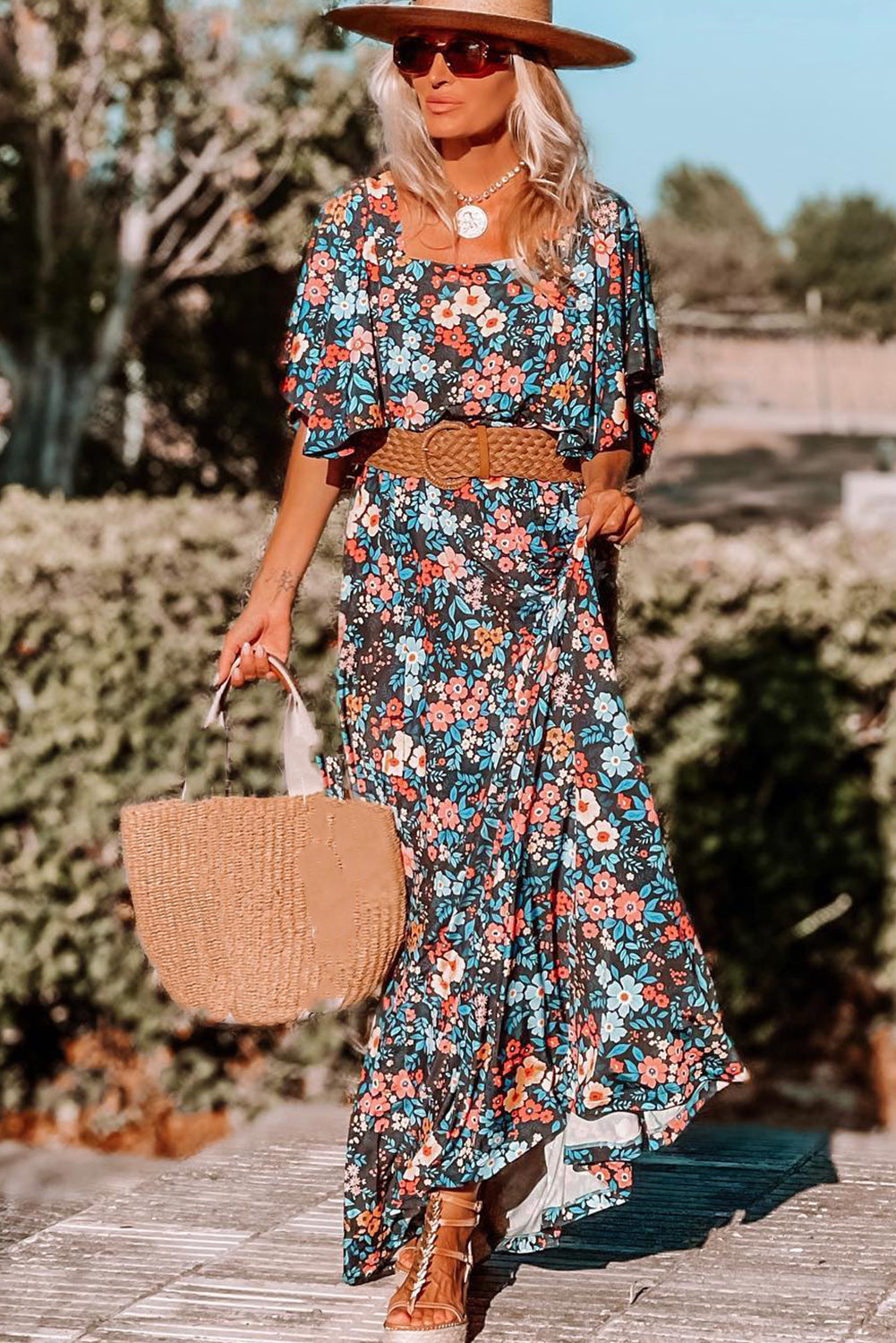 Vestido largo sin espalda anudado con estampado floral boho azul cielo