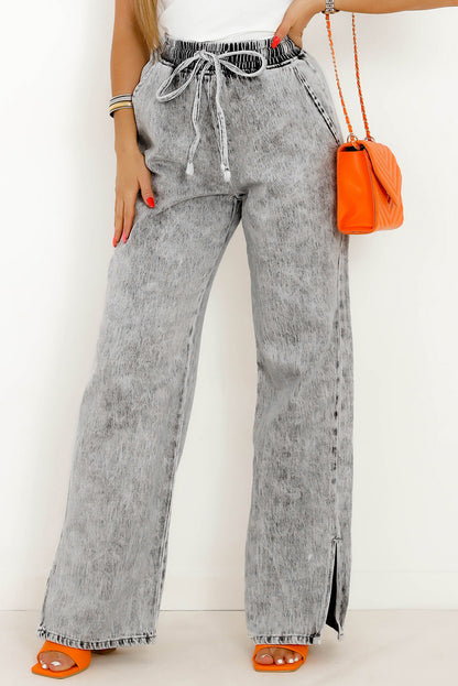 Jeans anchos con cintura elástica y cordón en gris medio