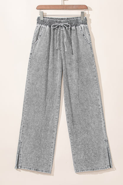 Jeans anchos con cintura elástica y cordón en gris medio