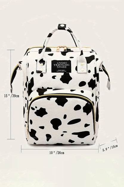 Mochila de lona con múltiples bolsillos y estampado de manchas de animales en blanco brillante