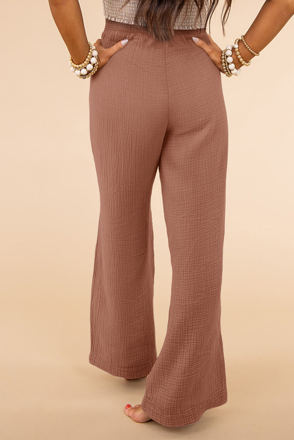 Pantalones anchos de talle alto con textura fruncida y talla grande rosa